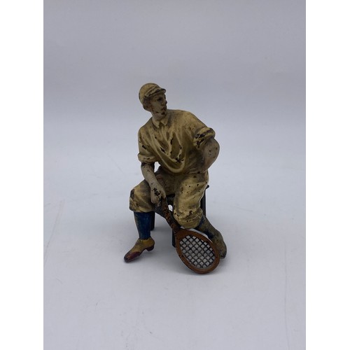 721 - TWO COLD PAINTED METAL FIGURES OF SEATED EDWARDIAN TENNIS PLAYERS