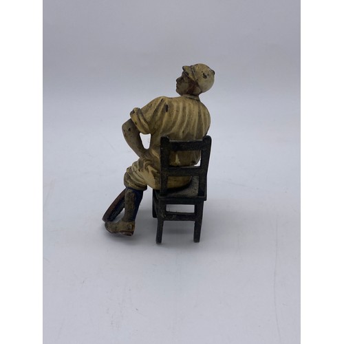 721 - TWO COLD PAINTED METAL FIGURES OF SEATED EDWARDIAN TENNIS PLAYERS