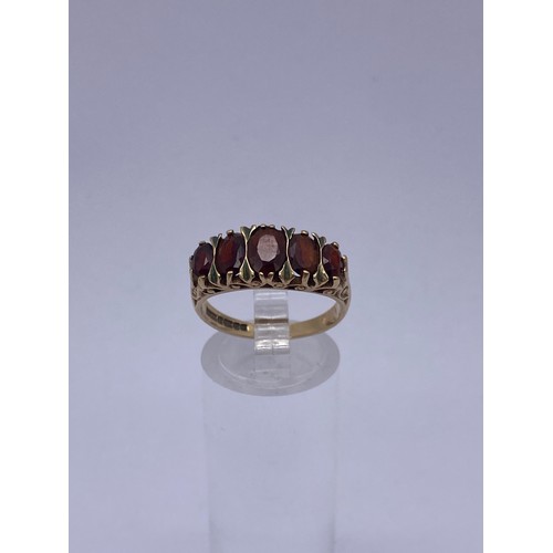 549 - 9CT GOLD FIVE STONE GARNET RING SIZE P 3.9G APPROX