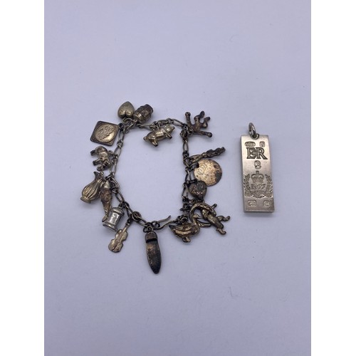 555 - 1977 SILVER BAR INGOT AND SILVER CHARM BRACELET