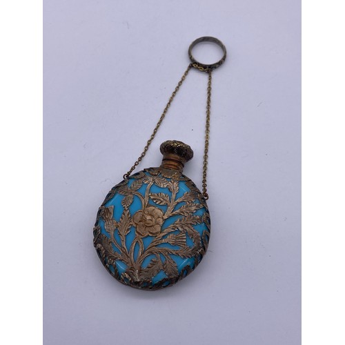 507 - TURQUOISE AND METAL FILIGREE OVERLAY MOON FLASK AND STOPPER AND A MARBLED GLASS EXAMPLE