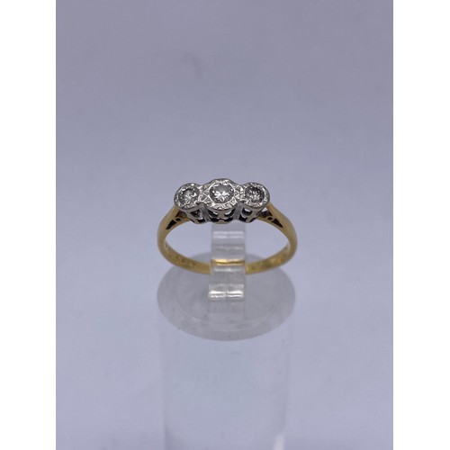 565 - 18CT AND PLATINUM THREE STONE DIAMOND RING 2.1G APPROX