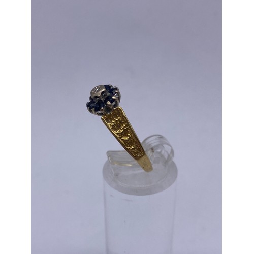 591 - 18CT GOLD DIAMOND CHIP AND SAPPHIRE CLUSTER RING WITH BARK EFFECT SHOULDERS SIZE M 3.9OZ