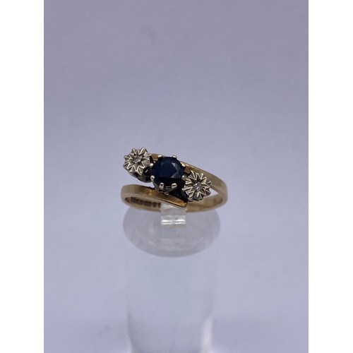 591A - 9CT GOLD SAPPHIRE AND DIAMOND CHIP CROSSOVER RING SIZE O 3.4G APPROX