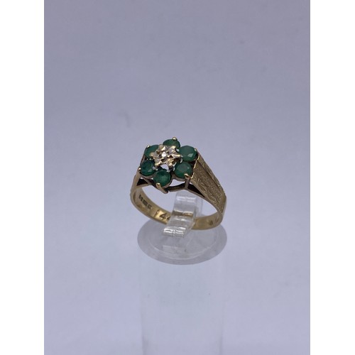 563 - 9CT GOLD EMERALD AND DIAMOND CHIP CLUSTER RING SIZE O 3.3G APPROX