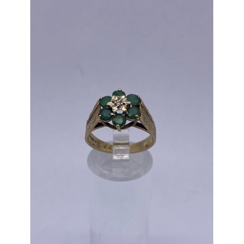 563 - 9CT GOLD EMERALD AND DIAMOND CHIP CLUSTER RING SIZE O 3.3G APPROX