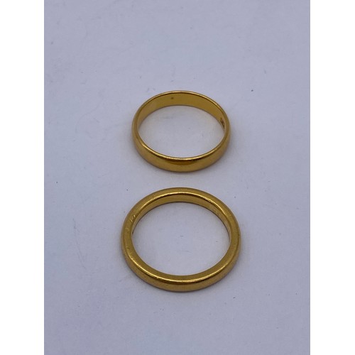 553 - TWO 22CT GOLD WEDDING BANDS 7.9G APPROX