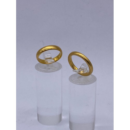 553 - TWO 22CT GOLD WEDDING BANDS 7.9G APPROX