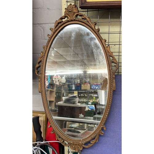 484 - GILT ARCHED OVAL MIRROR