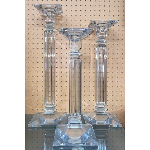 669 - SET OF THREE GRADUATED GLASS FLUTED CANDLE STANDS