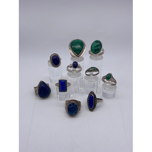 625 - SILVER AND WHITE METAL MALACHITE LAPIS LAZULI SET DRESS RINGS