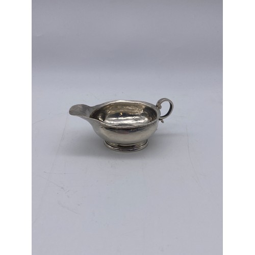 644 - SMALL UNMARKED WHITE METAL COIN JUG 1.4OZ APPROX