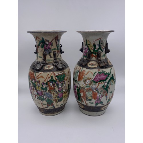 668 - PAIR OF CHINESE CRACKLE GLAZED BALUSTER VASES PAINTED WITH WARRIORS AND APPLIED LIZARDS