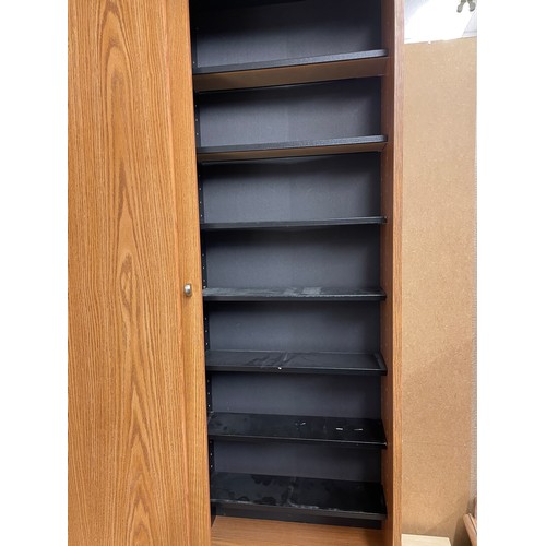 44 - OAK EFFECT SLIDING DOOR CD STORAGE CUPBOARD