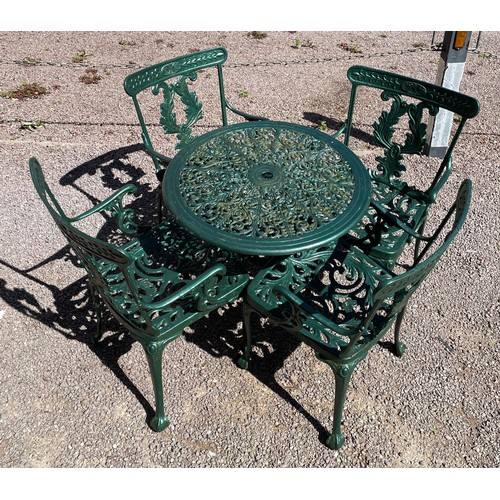 106 - GREEN PAINTED VICTORIAN STYLE CICULAR PATIO TABLE AND FOUR ELBOW CHAIRS