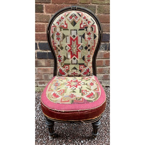 197 - LATE VICTORIAN EBONISED AND PARCEL GILT FRAMED NURSING CHAIR WITH BERLIN NEEDLE WORK COVERING