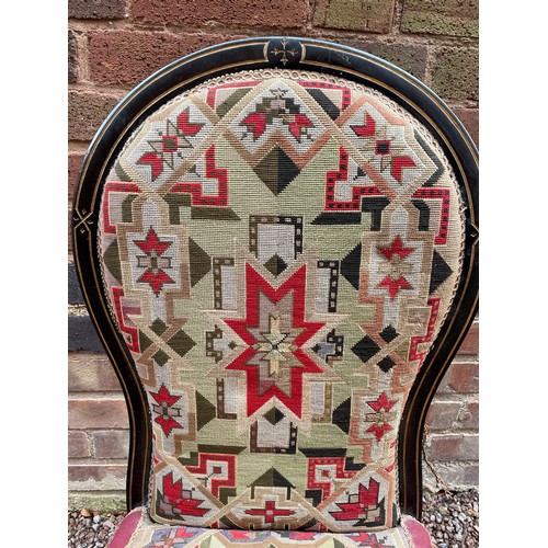 197 - LATE VICTORIAN EBONISED AND PARCEL GILT FRAMED NURSING CHAIR WITH BERLIN NEEDLE WORK COVERING