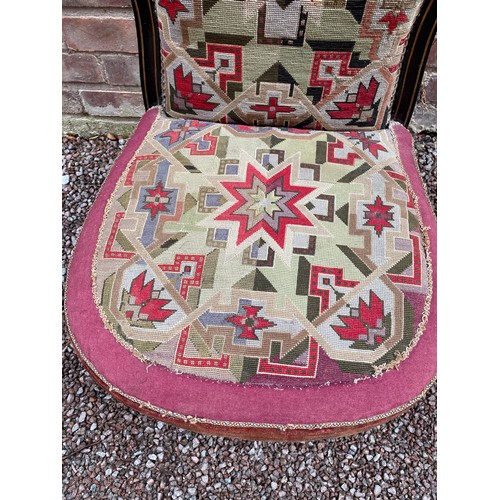 197 - LATE VICTORIAN EBONISED AND PARCEL GILT FRAMED NURSING CHAIR WITH BERLIN NEEDLE WORK COVERING