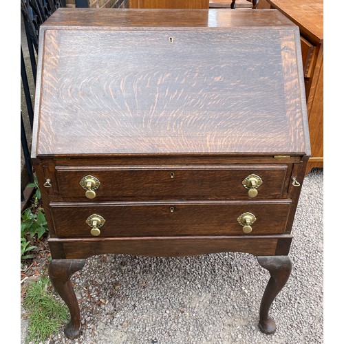 122 - OAK TWO DRAWER BUREAU ON CABRIOLE LEGS