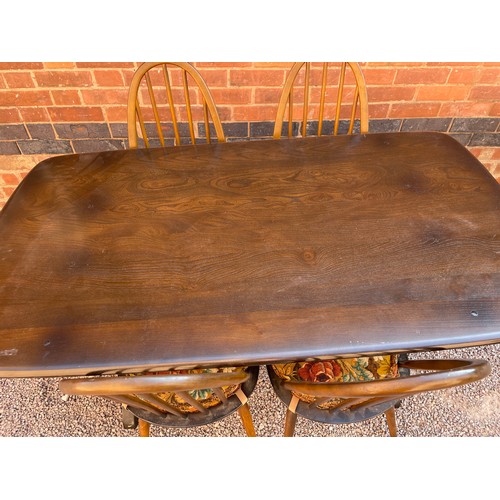 35 - ERCOL ELM REFECTORY TABLE AND FOUR HOOP BACK CHAIRS