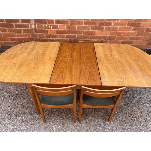 40 - TEAK OVAL DINING TABLE AND FOUR CHAIRS