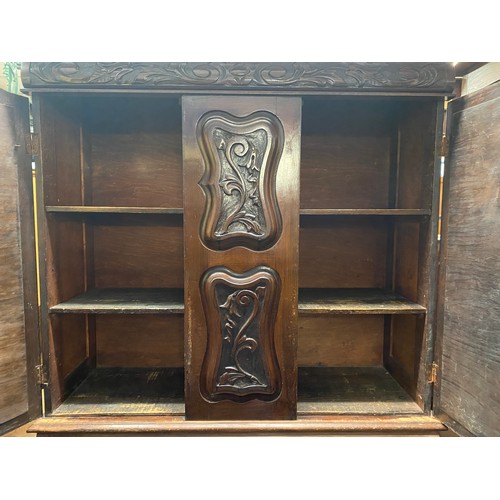 142 - EDWARDIAN HEAVILY CARVED CHEST CUPBOARD