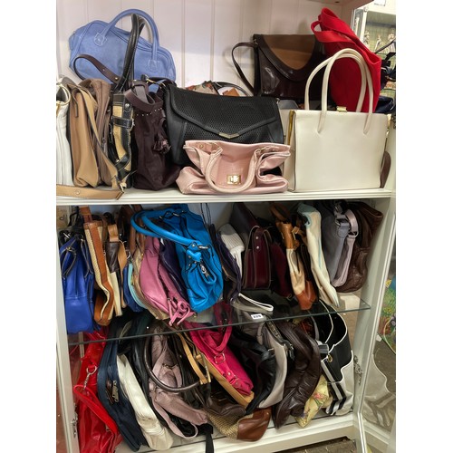 229 - THREE SHELVES OF VARIOUS HANDBAGS AND TOTE BAGS