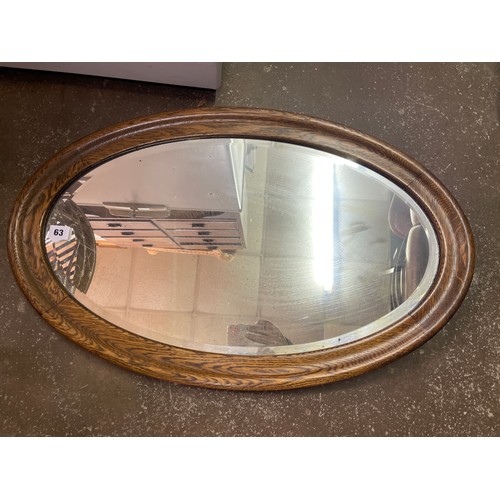 63 - OVAL OAK FRAMED MIRROR