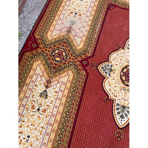 21 - RED AND CREAM GROUND PATTERN CARPET 335 cm x 240cm