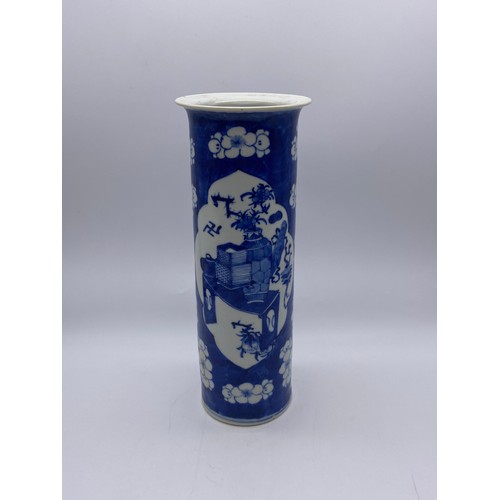 538 - CHINESE BLUE AND WHITE PRUNUS SLEEVE VASE WITH PANELS ADORNED WITH ATTRIBUTES