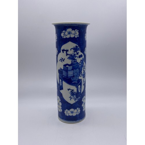 538 - CHINESE BLUE AND WHITE PRUNUS SLEEVE VASE WITH PANELS ADORNED WITH ATTRIBUTES