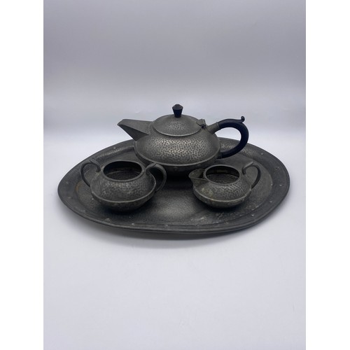 535 - ARTS AND CRAFTS BEATEN PEWTER THREE PIECE TEA SERVICE ON TRAY BY CRAFTSMAN