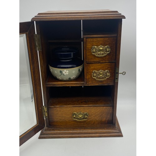 603 - OAK GLAZED DOOR SMOKERS CABINET WITH STONEWARE HUMIDOR