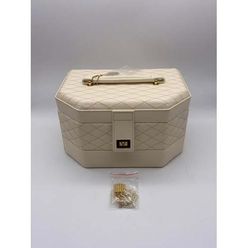 667 - BOXED AS NEW QUILTED STITCHED LEATHER JEWELLERY BOX AND SMALLER TRAVELLING JEWELLERY BOX