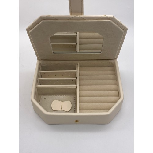 667 - BOXED AS NEW QUILTED STITCHED LEATHER JEWELLERY BOX AND SMALLER TRAVELLING JEWELLERY BOX