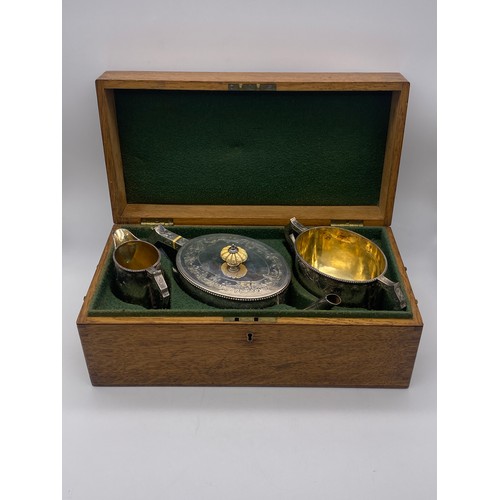 634 - LONDON VICTORIAN SILVER THREE PIECE ENGRAVED TEA SERVICE IN FITTED OAK BOX 46 OZ OVERALL APPROX