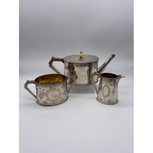 634 - LONDON VICTORIAN SILVER THREE PIECE ENGRAVED TEA SERVICE IN FITTED OAK BOX 46 OZ OVERALL APPROX