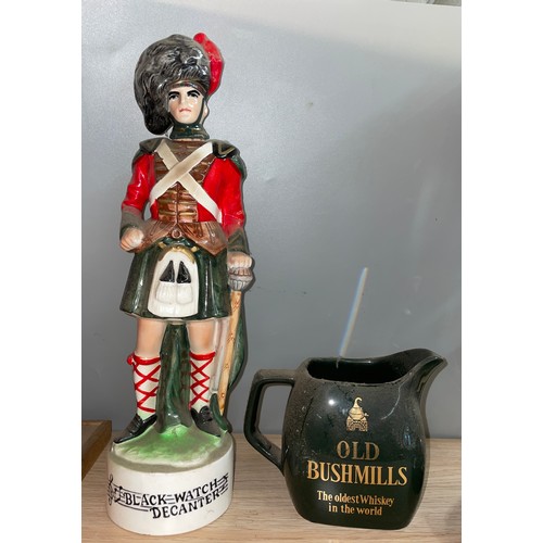 470 - OLD BUSHMILLS WATER JUG AND A BLACKWATCH FIGURE DECANTER