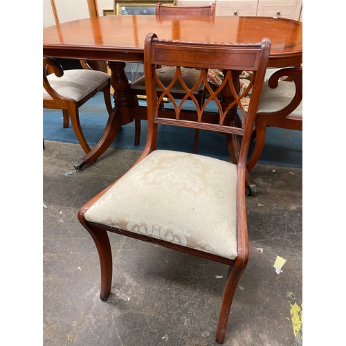 52 - YEW CROSS BANDED EXTENDING DINING TABLE AND SIX CHAIRS