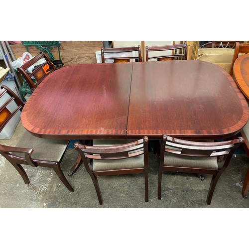 44 - REPRODUCTION MAHOGANY CROSS BANDED EXTENDING DINING TABLE WITH SIX SABRE LEG DINING CHAIRS