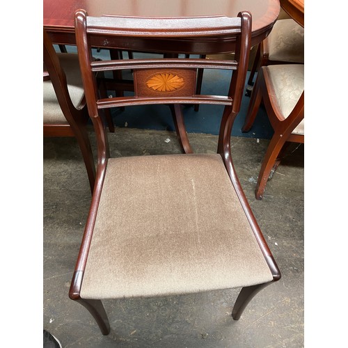 44 - REPRODUCTION MAHOGANY CROSS BANDED EXTENDING DINING TABLE WITH SIX SABRE LEG DINING CHAIRS