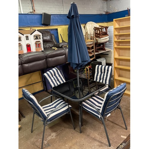 190 - GREY TUBULAR METAL PATIO TABLE AND FOUR STACKING CHAIRS WITH STRIPED CUSHIONS AND PARASOL