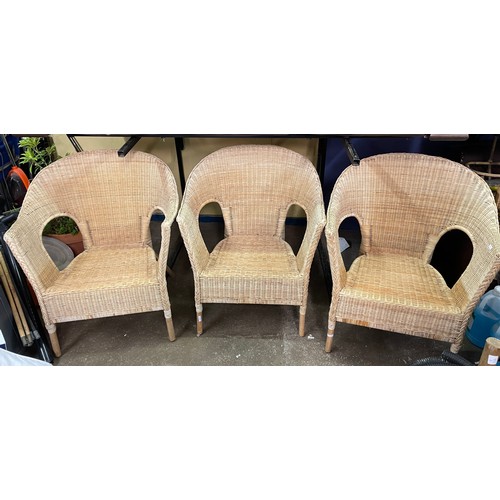 91 - THREE RATTAN AND CANE WORK GARDEN CHAIRS WITH LOOSE CUSHIONS
