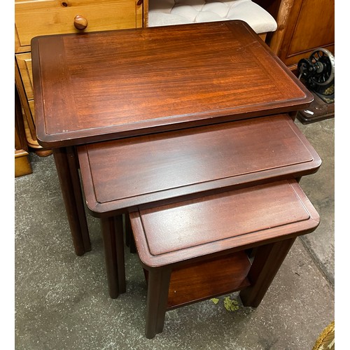 99 - NEST OF MAHOGANY TABLES