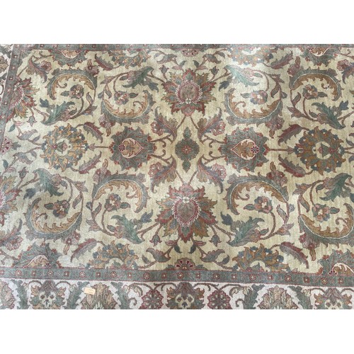 15 - ROLLED GREEN PATTERN FRINGED CARPET 270CM x 185CM