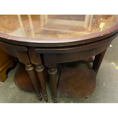 199 - CIRCULAR MAHOGANY GLASS TOP NEST OF TABLES