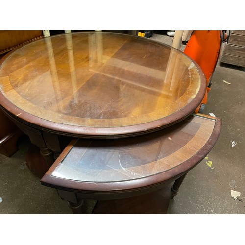 199 - CIRCULAR MAHOGANY GLASS TOP NEST OF TABLES