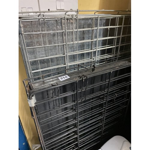 214 - TWO GALVANISED AND WIRE WORK DOG CRATES