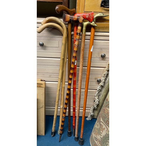 8 - TWO BRASS HEADED WALKING CANES AND OTHER PAINTED CANES