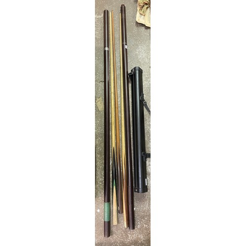 81 - TWO SNOOKER CUES IN TUBE HOLDERS, AND A COMBI CASE WITH CUE